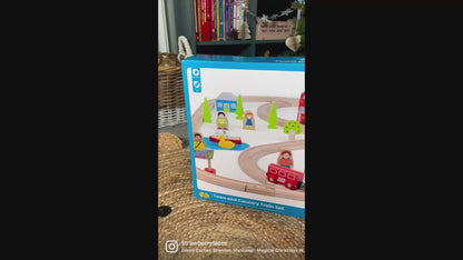 Video demonstration of the Bigjigs Toys Town & Country Train Set, showing children arranging the wooden track, pushing the colourful train, and exploring the town and countryside accessories through imaginative play.