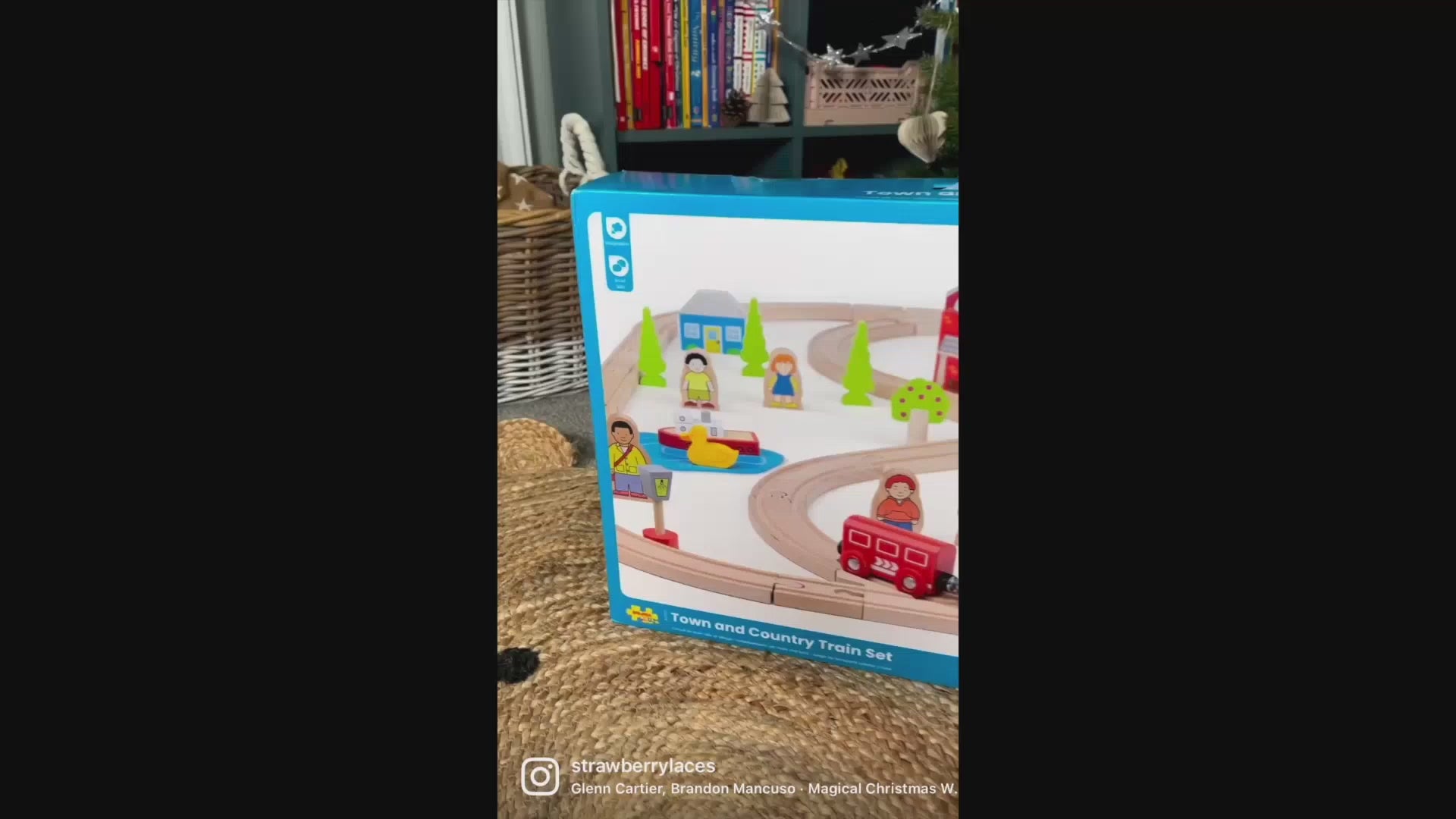 Video demonstration of the Bigjigs Toys Town & Country Train Set, showing children arranging the wooden track, pushing the colourful train, and exploring the town and countryside accessories through imaginative play.