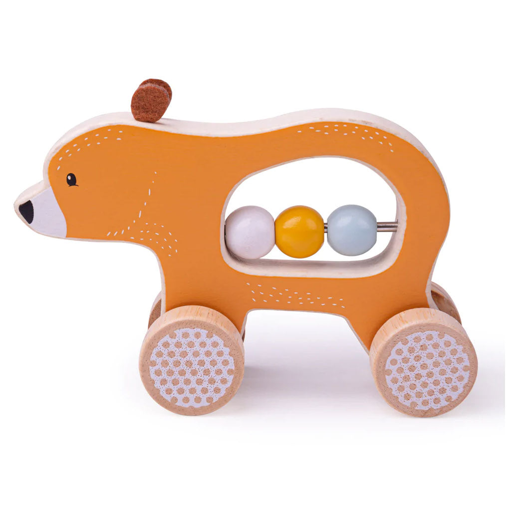 Wooden FSC® Certified Push Along Bear helps little ones to develop their fine motor skills! The sturdy wheels roll smoothly along the floor and when it’s time for the bear to rest, busy little fingers can play with the three wooden beads in its belly.