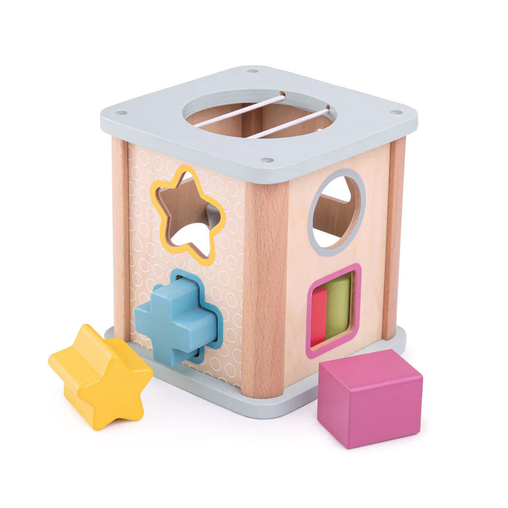 100% FSC Wooden Shape Sorter. Slot the brightly coloured wooden shapes through the correct slot on the top of the shape sorter and watch them drop into the middle. Features a hole for easy access to the wooden shapes, too.