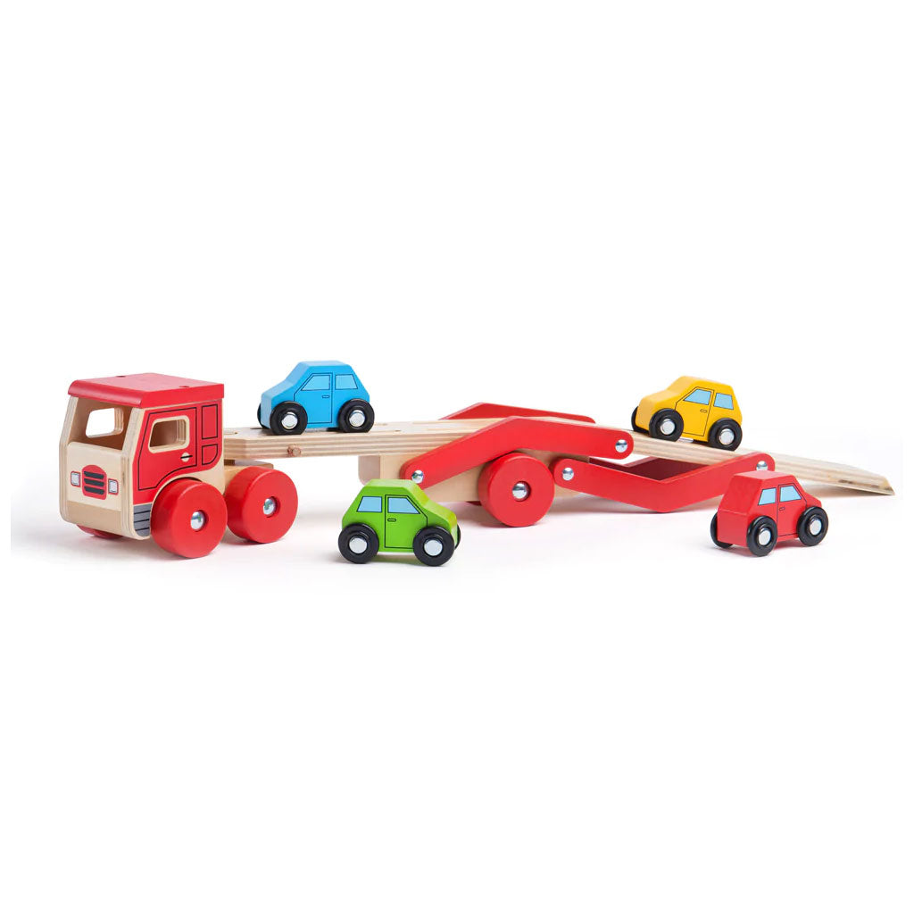 This wooden Transporter Lorry Toy helps to develop kids’ dexterity and coordination as they play. It carries a load of four colourful wooden cars (which slot nicely onto the trailer) and is safe for little hands to play with.
