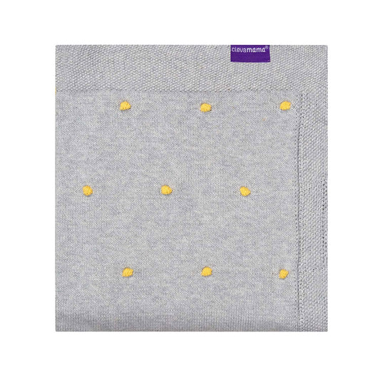 This soft Knitted Blanket by Clevamama combines luxurious 100% Organic Cotton with a stylish baby-safe pom pom design. Ideal for using while out and about, or when you just fancy a cuddle.