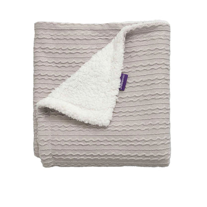 Clevamama Luxe Sherpa Baby Blanket in grey, neatly folded with one corner turned over to reveal the white sherpa fleece lining.