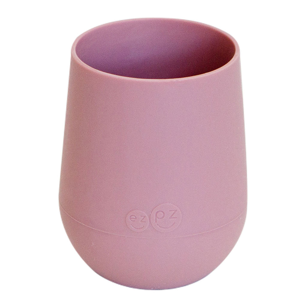 The Ezpz Mini Cup is designed to fit a toddler's mouth and hands. The cup's soft silicone protects developing teeth and gums, and the non-slip silicone grip makes movements to the mouth more successful.