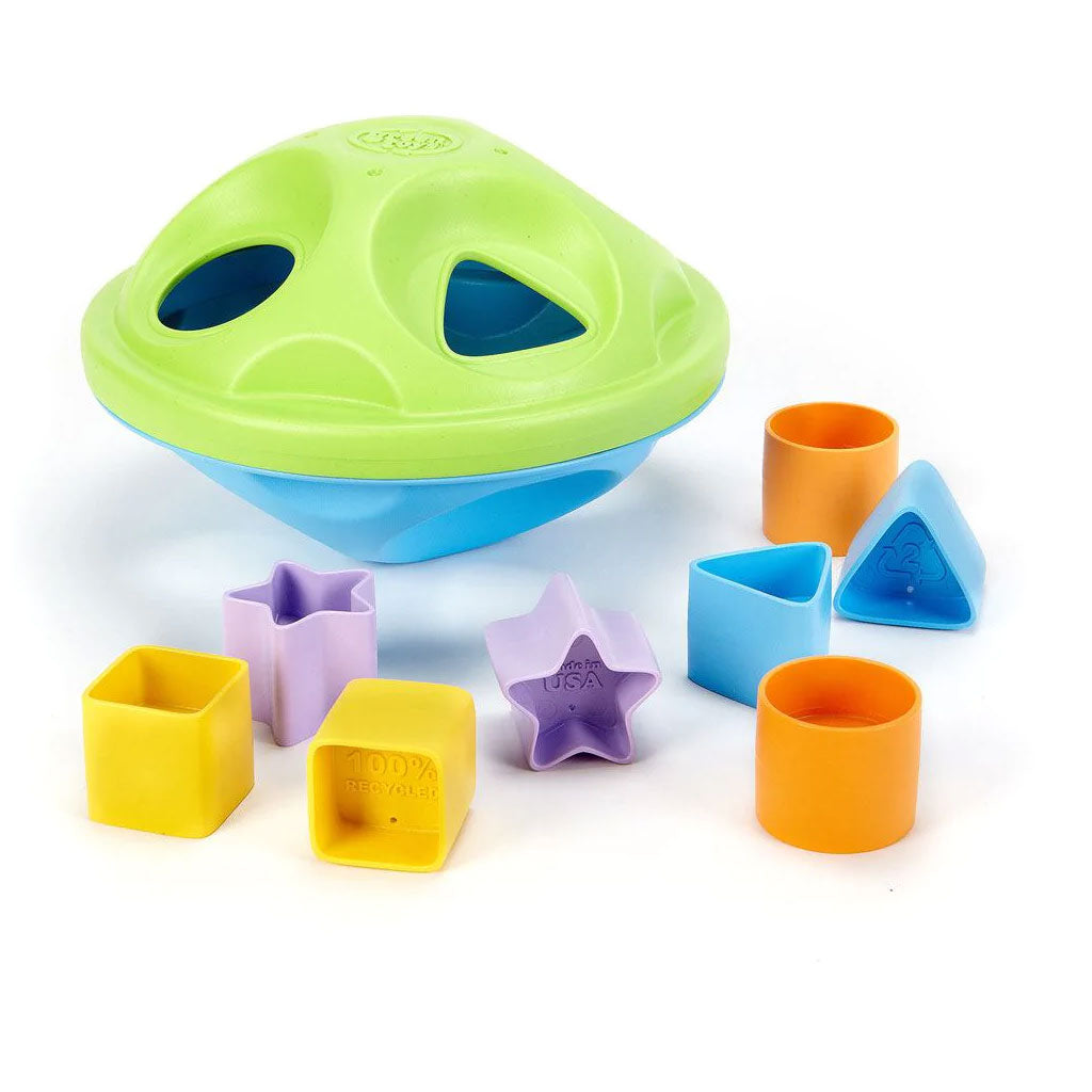 The two-part elliptical Shape Sorter and colourful shapes (stars, circles, squares and triangles) are the perfect size and weight for little hands. Each piece slides easily into the cut-outs on both the top and bottom of the Sorter, which opens with a simple twist, separating the two halves and letting the pieces out again. 
